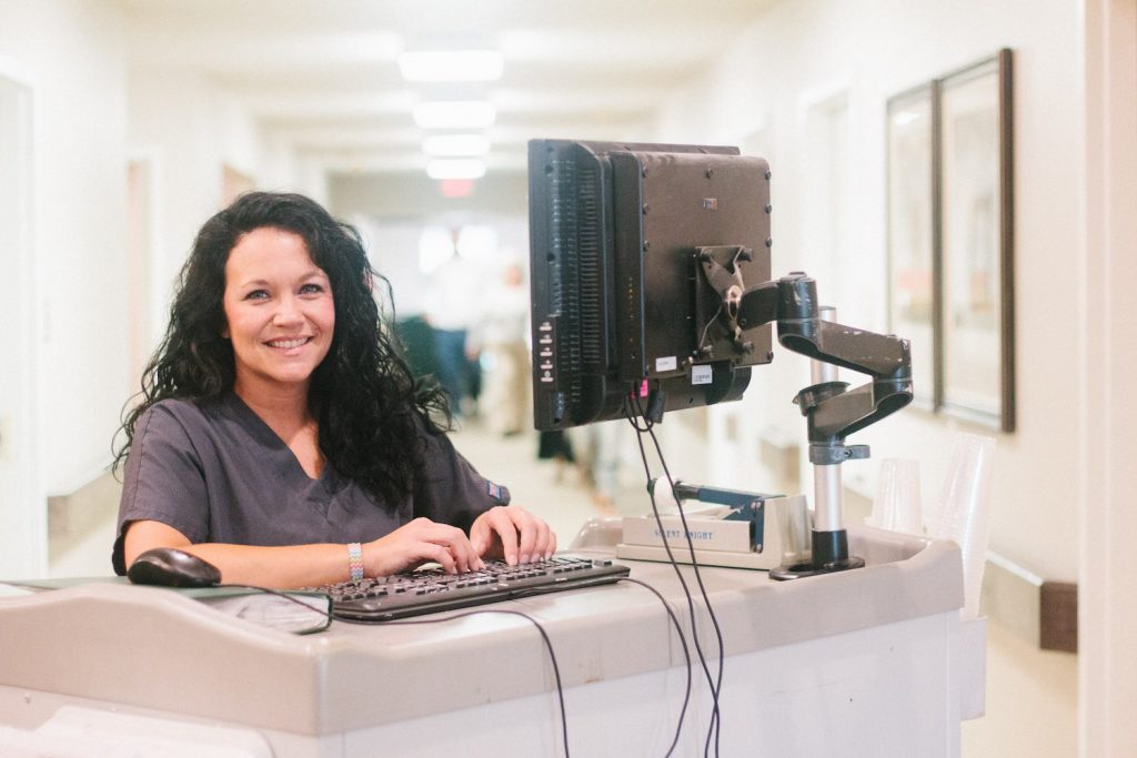 A woman providing resources to families in need of skilled nursing